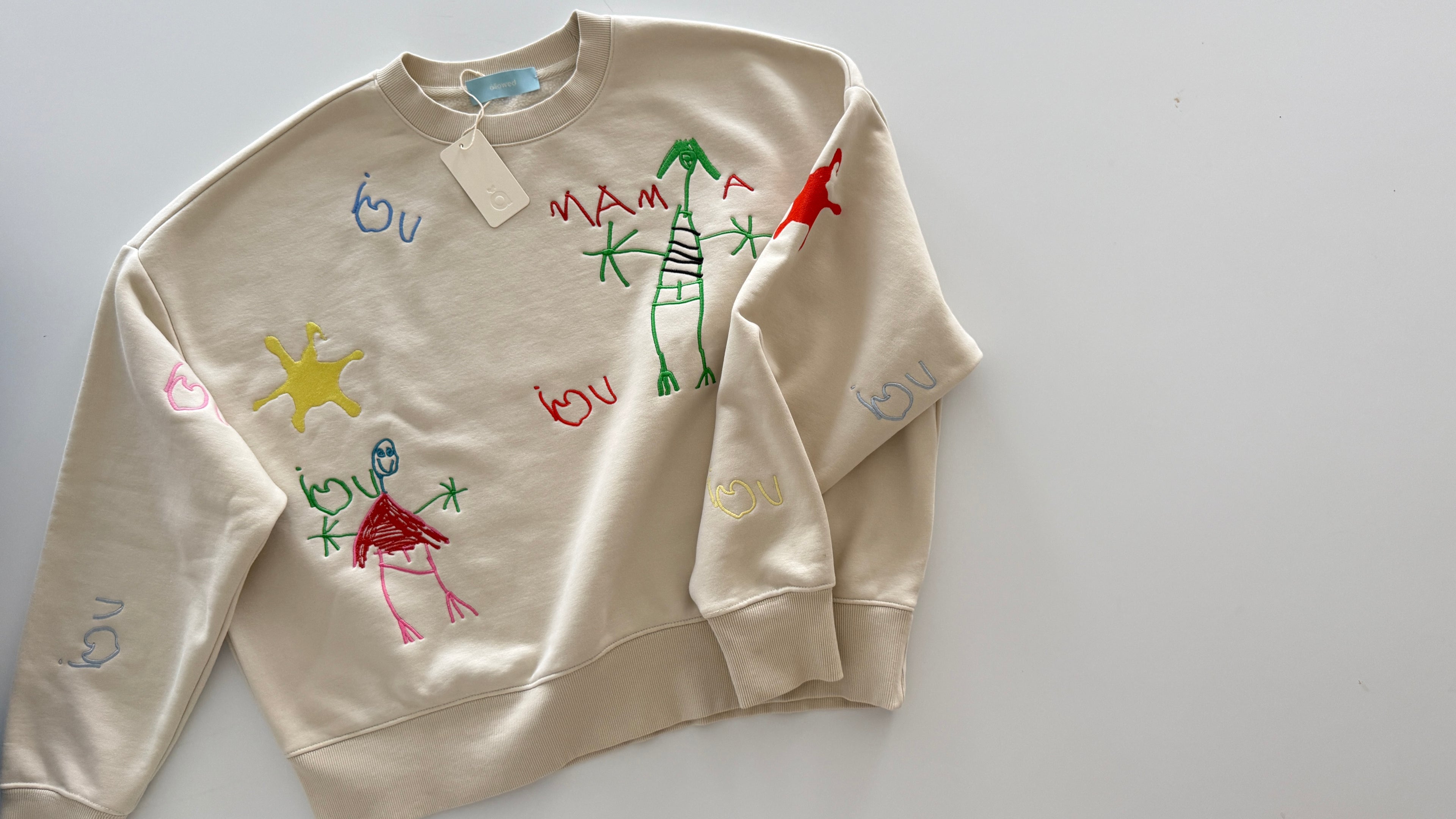 Kid's drawing embroidered on a premium sweatshirt for mama. Mother's Day Gift idea 2026.